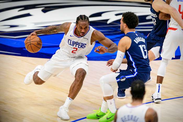May 28, 2021; Dallas, Texas, USA; LA Clippers forward Kawhi Leonard (2) brings the ball up court past Dallas Mavericks guard Jalen Brunson (13) during the second half in game three in the first round of the 2021 NBA Playoffs at American Airlines Center. Mandatory Credit: Jerome Miron-USA TODAY Sports